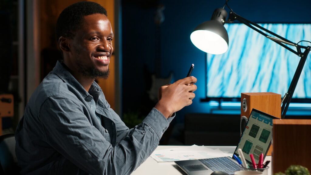 independent adult teleworking from home and using his mobile phone